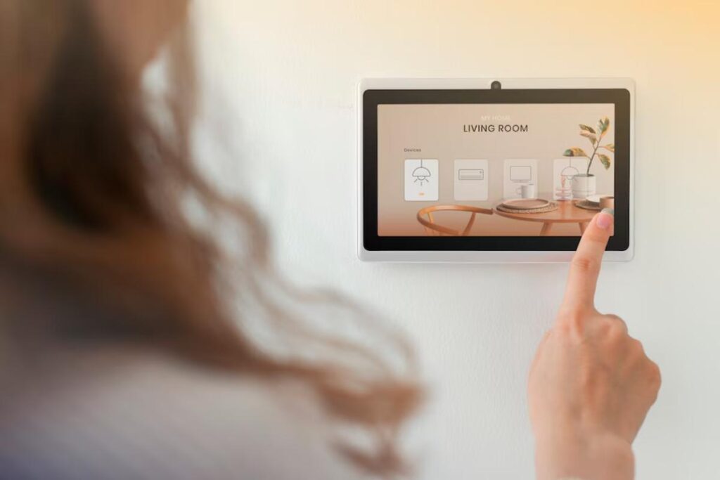 A person interacts with a smart home control panel displaying options for the living room, featuring lighting and appliance controls.